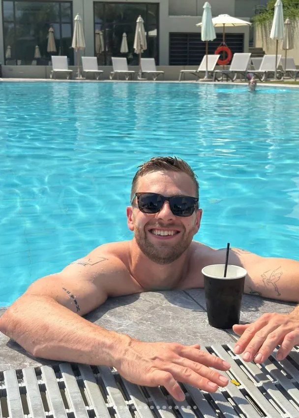 Will smiling by a swimming pool